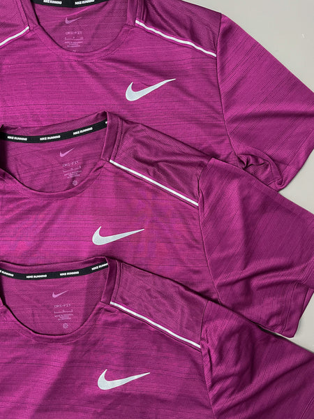 purple pink nike shirt